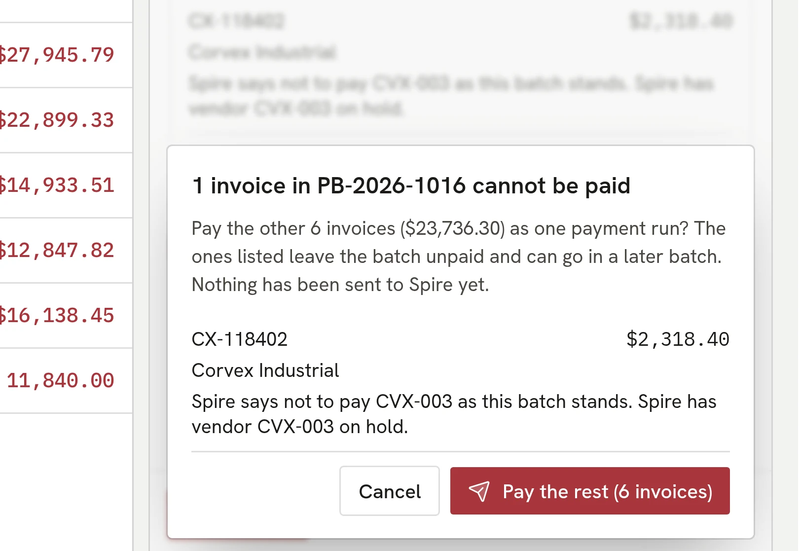 A payment batch pre-check naming one invoice that cannot be paid because the vendor is on hold in Spire.