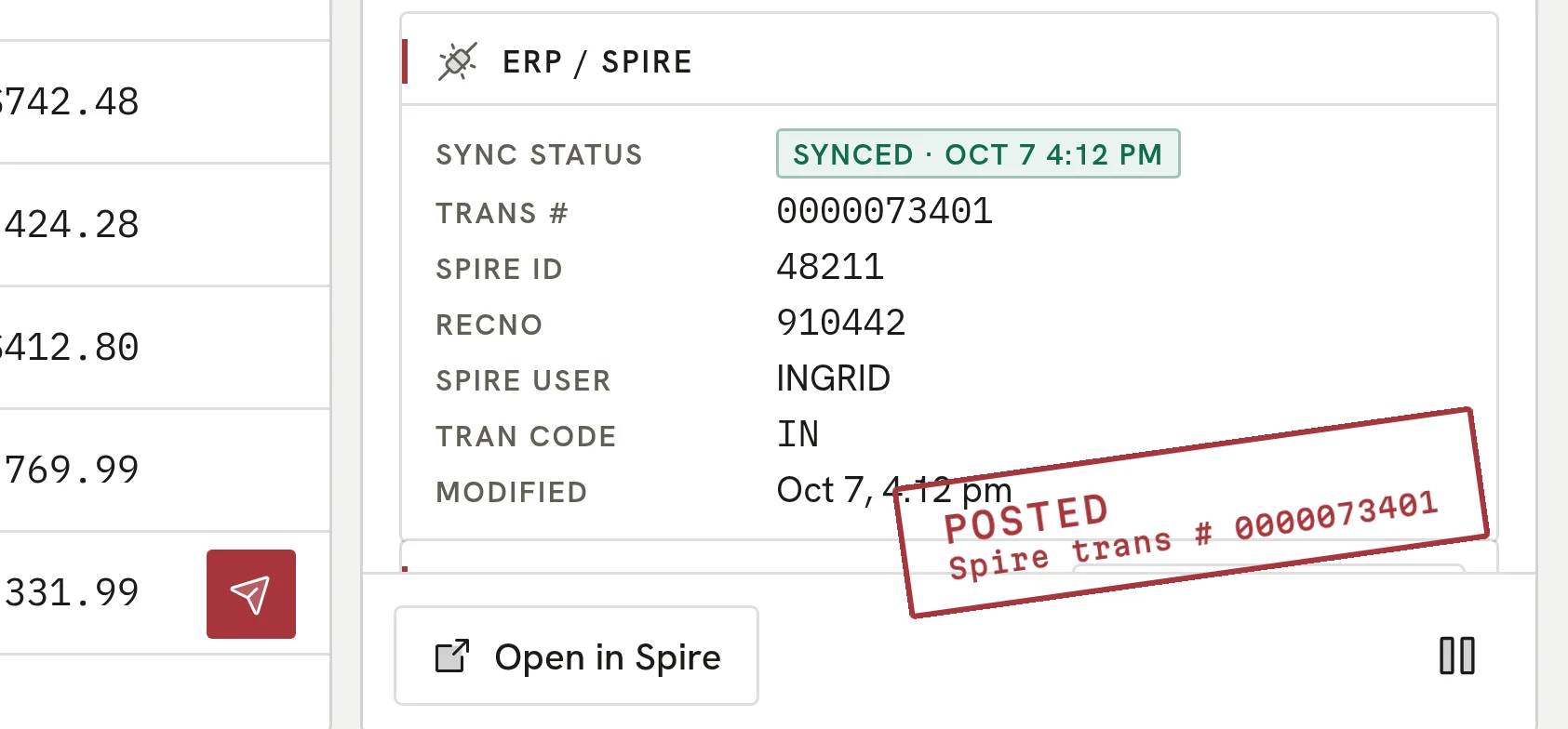The Spire tab of a posted invoice with its transaction number and Spire ID.